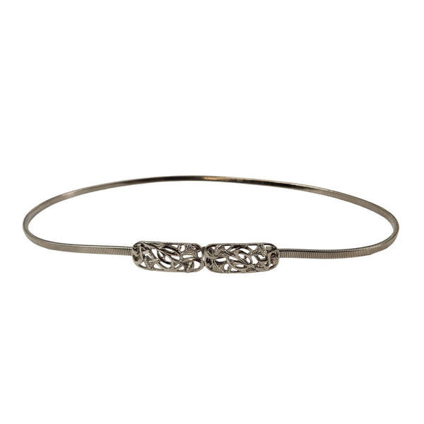Silver stretch belt with ornate floral filigree buckle center