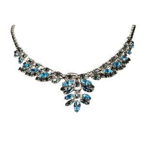 Silvertone rhinestone necklace with blue and green stones, scalloped front pendant