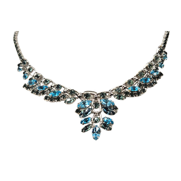 Silvertone rhinestone necklace with blue and green stones, scalloped front pendant