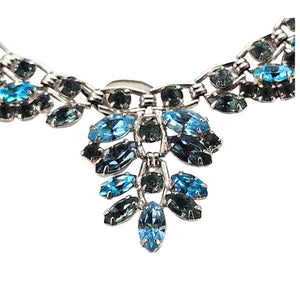 Silvertone rhinestone necklace center cluster with blue and teal stones in leaf shapes