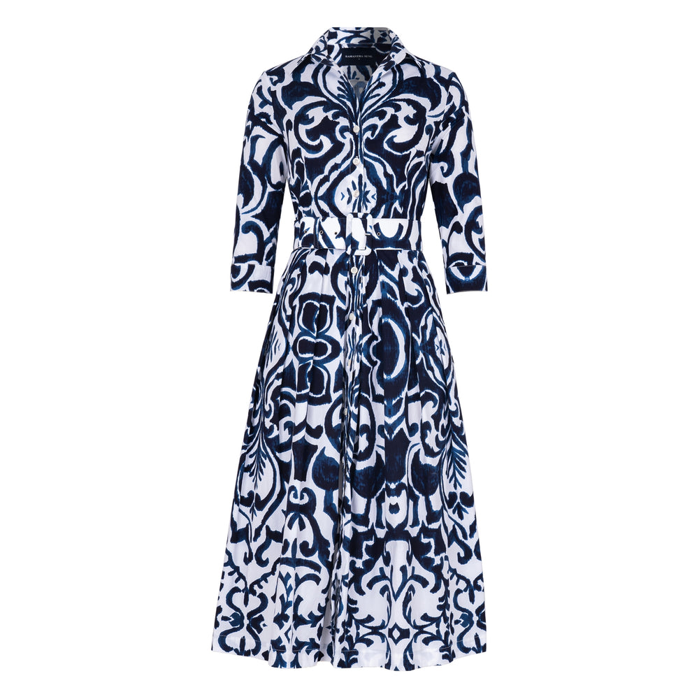 Women's long-sleeve button-front dress with navy and white tile print, waist tie