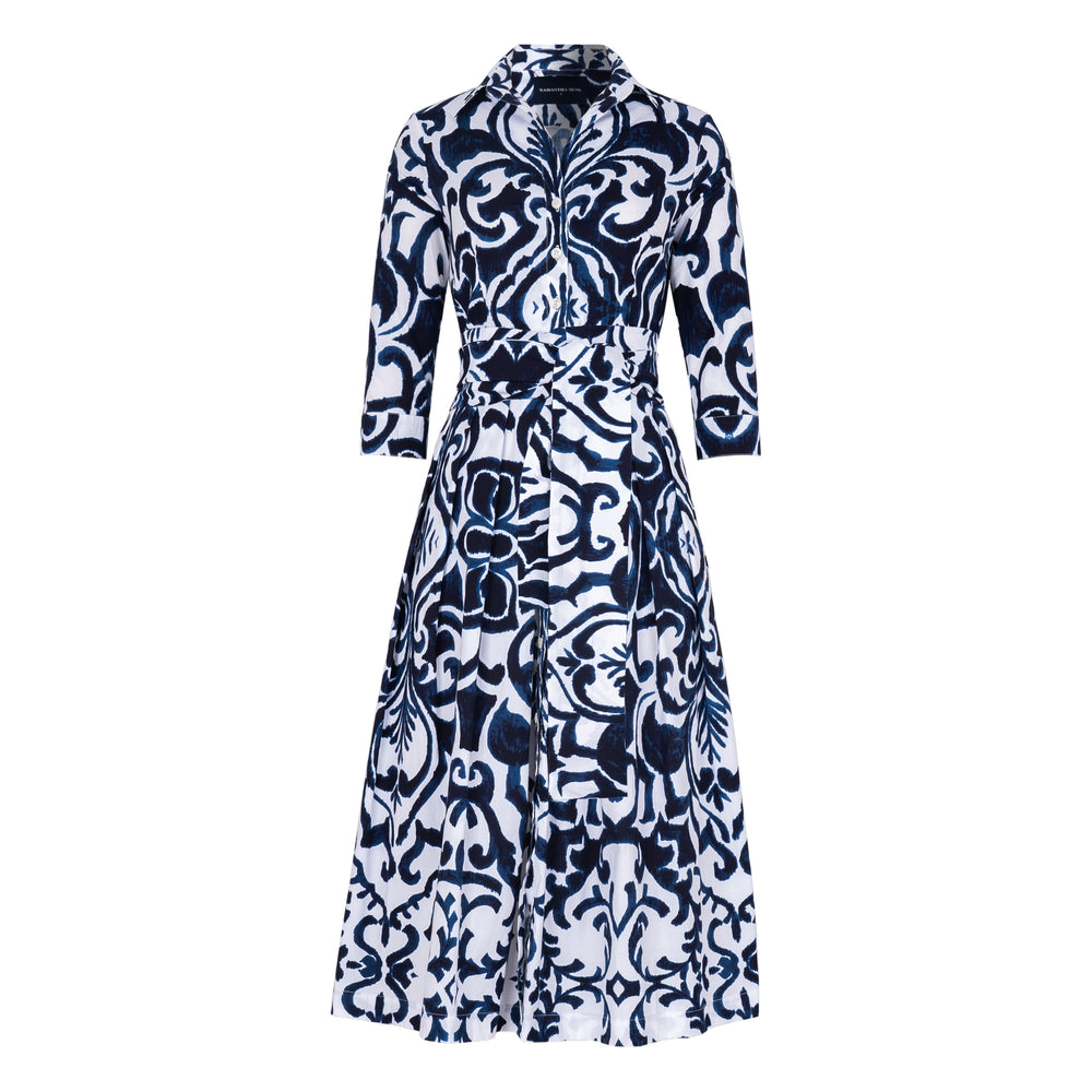 Women's long-sleeve button-front dress with navy and white tile print, waist tie