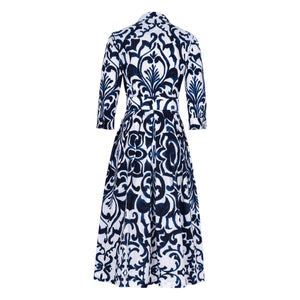 Women's long-sleeve button-front dress with navy-and-white baroque tile print, cinched waist