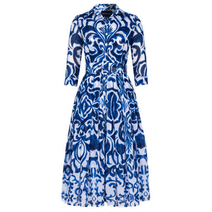 Long-sleeve midi dress in blue-and-white tile print with button front and fitted waist