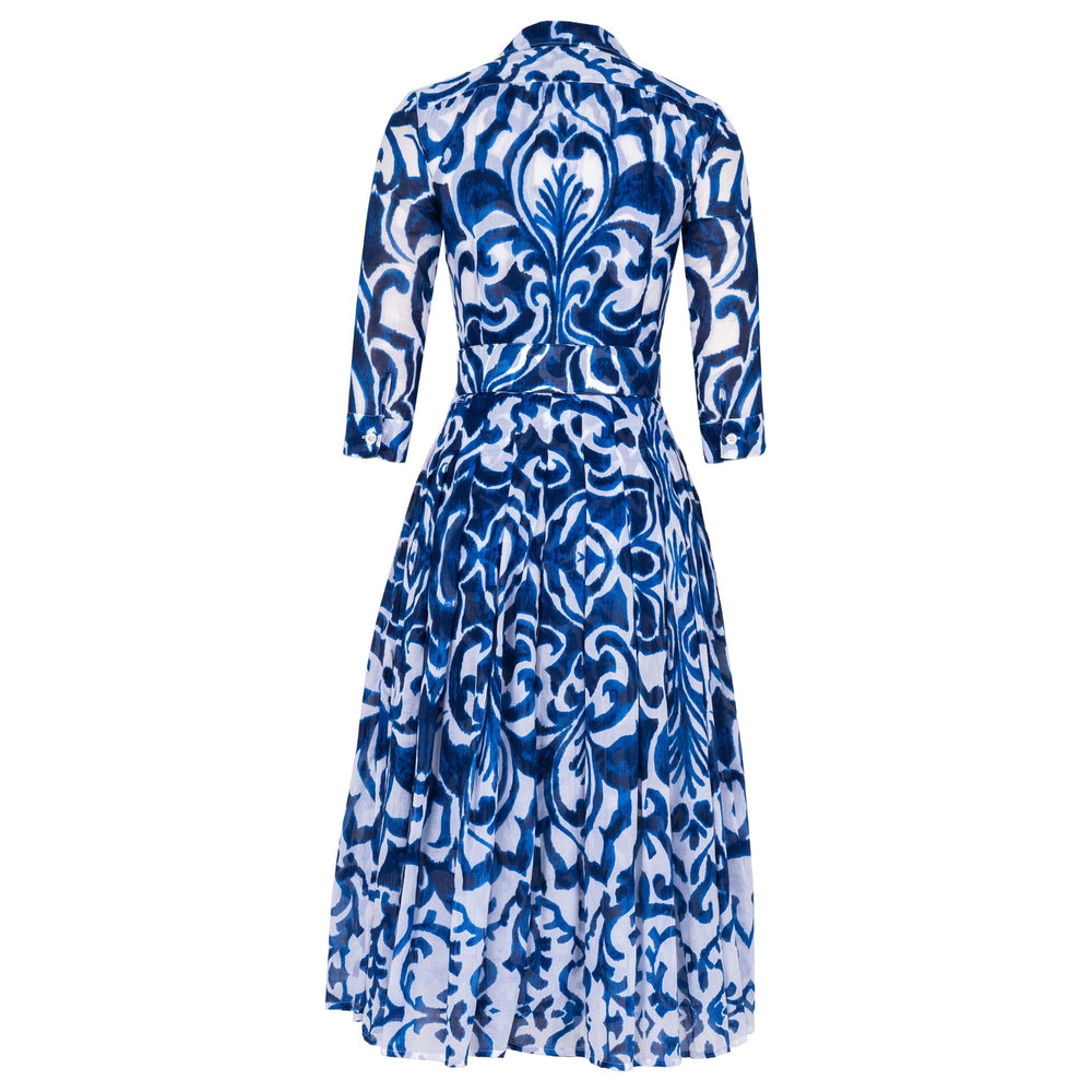 Long-sleeve midi dress in blue-and-white tile print with button front and fitted waist