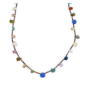 Multicolor gemstone bead necklace with small faceted stones on a dark chain