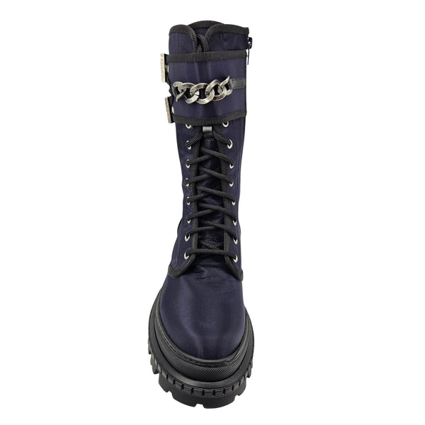 Navy combat boot with chain strap across ankle, lace-up front, lug sole