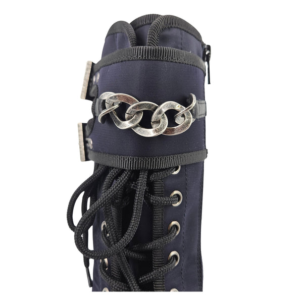 Navy boot cuff with chain detail and lace-up laces, metal buckles