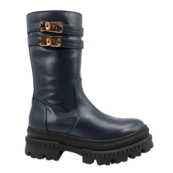 Navy shearling-lined platform boots with two gold buckle straps and chunky tread sole