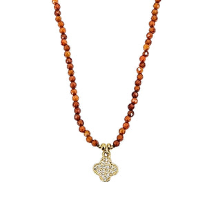Orange faceted bead necklace with glitter clover charm pendant, silver-tone beadwork