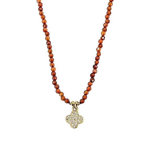 Orange faceted bead necklace with glitter clover charm pendant, silver-tone beadwork