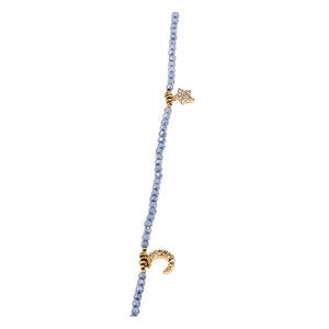 Charm necklace single strand with gold-toned heart and cross charms on blue beads