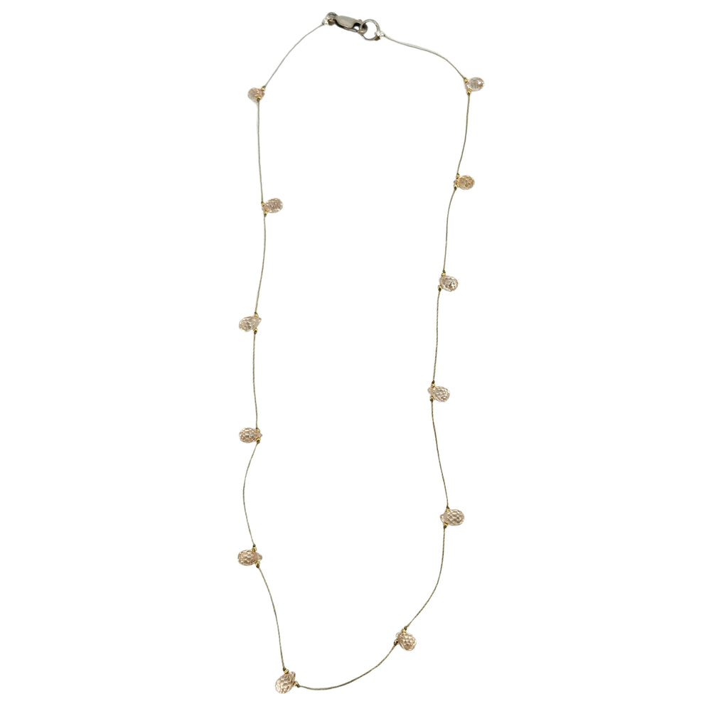 Peach teardrop gemstone station necklace with faceted beads on thin gold chain