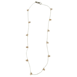 Peach teardrop gemstone station necklace with faceted stones on gold chain and clasp