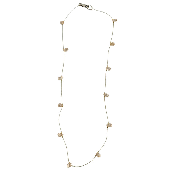 Peach teardrop gemstone station necklace with faceted stones on gold chain and clasp
