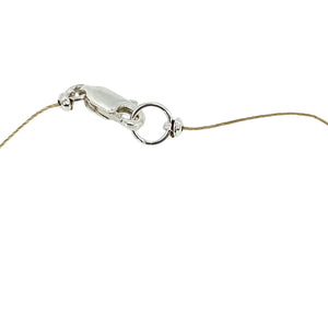 Gold-tone necklace clasp with linked chain and small teardrop faceted stone details