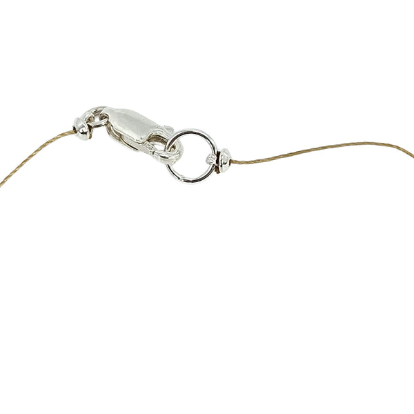 Gold-tone necklace clasp with linked chain and small teardrop faceted stone details