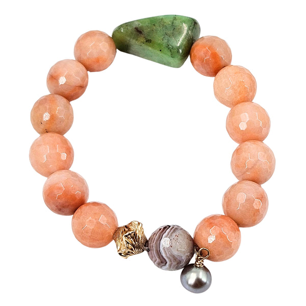 Peach-pink beaded stretch bracelet with green stone and pearl charm