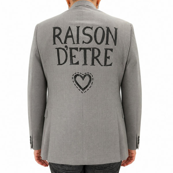 Grey blazer with back text and heart graphic, notch lapels, long sleeves
