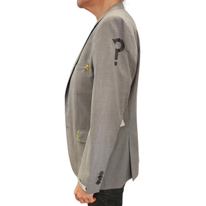 Grey blazer side view with question mark graphic on sleeve and button cuff