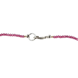 Pink beaded necklace with silver toggle clasp in the center