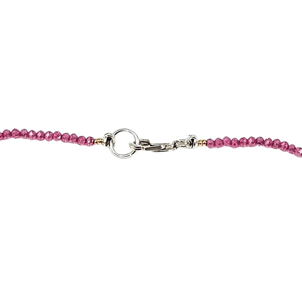 Pink beaded necklace with silver toggle clasp in the center