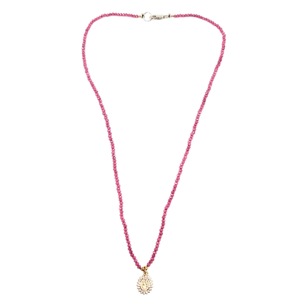 Pink beaded necklace with small silver clasp and gold round Mary pendant