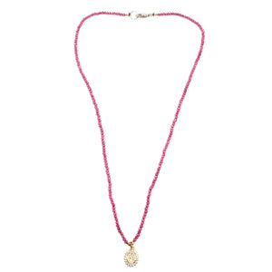 Pink beaded necklace with small silver clasp and gold round Mary pendant