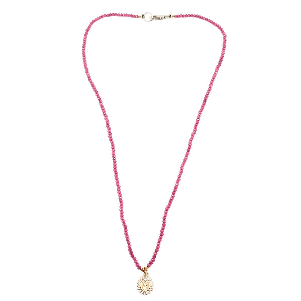 Pink beaded necklace with small silver clasp and gold round Mary pendant