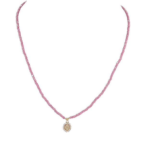 Pink beaded necklace with gold round Mary pendant at the bottom