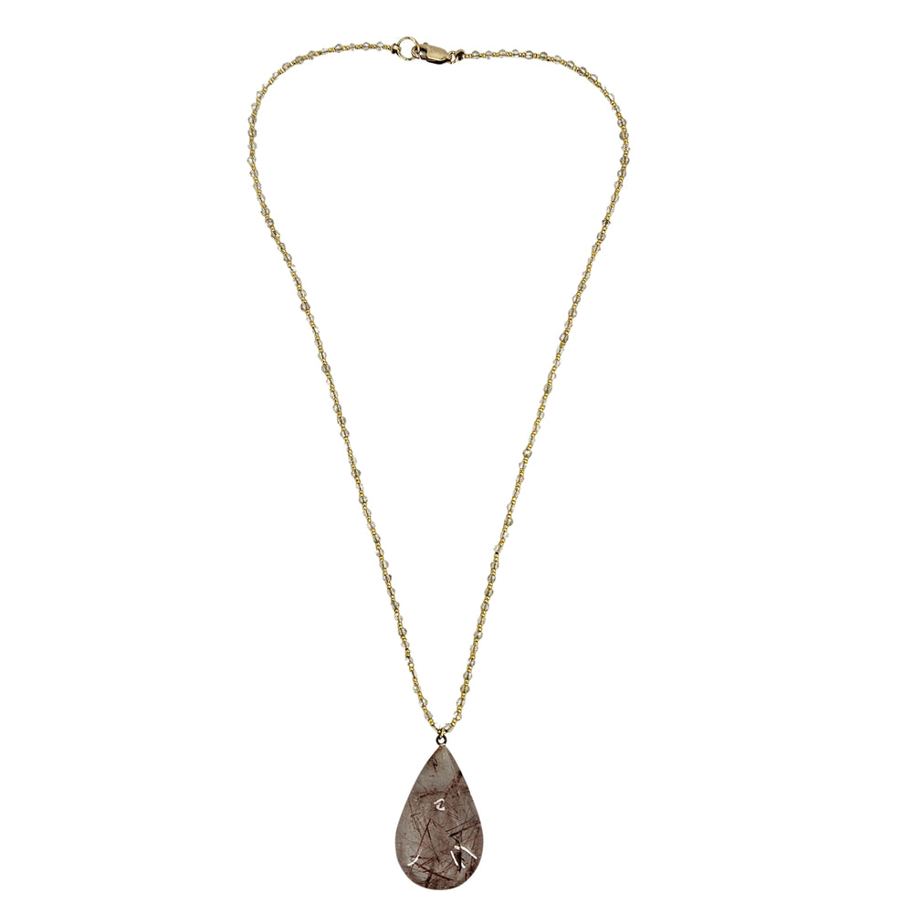 Gold-tone chain necklace with brown rutilated teardrop gemstone pendant