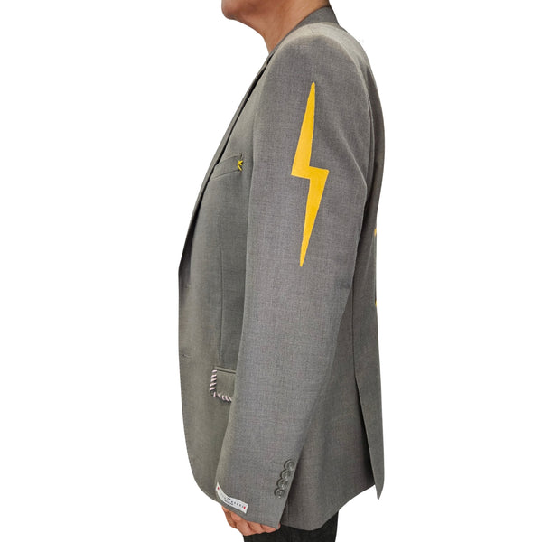 Grey blazer with yellow lightning graphic on sleeve and contrast-stitched cuff