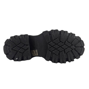 Platform boot outsole with black tread and branding detail.