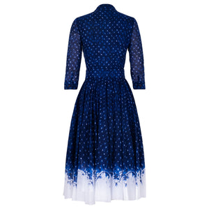 Midnight blue shibori dress, back view, button-front, belted waist, white hem
