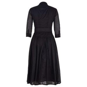 Black midi dress with three-quarter sleeves, pleated skirt, belted waist