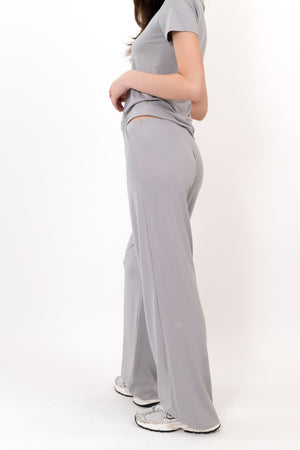 Grey flow pants side view, relaxed wide legs with roomy drape