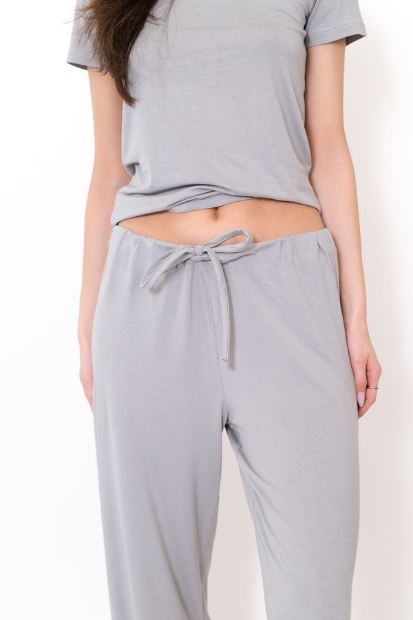 Light grey drawstring lounge pants with relaxed straight legs
