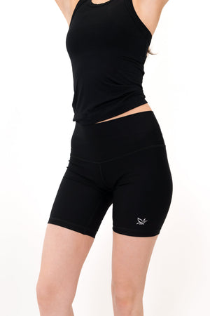 Black 5-inch core shorts side view with fitted silhouette and logo at hem