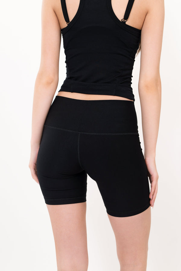 Black 5-inch core shorts back view with fitted legs and stitched center seam