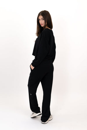 Black wide-leg sweatpants with relaxed straight legs and side pockets