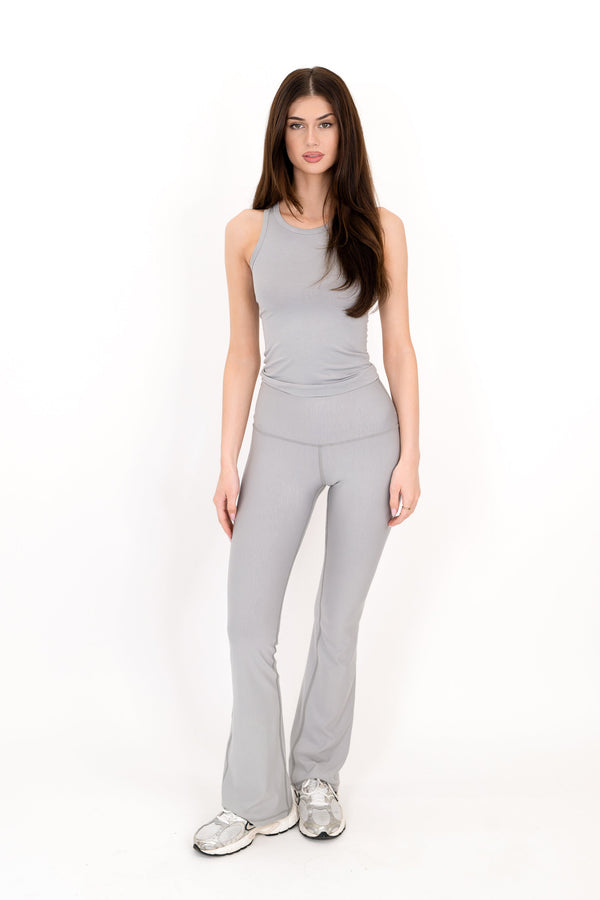 Gray high-rise flare legging, full-length with smooth seams and wide bootcut hem.