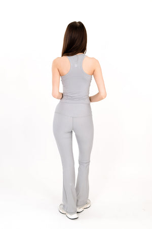 Gray flare legging back view, high-rise waistband and bootcut flare at hem.