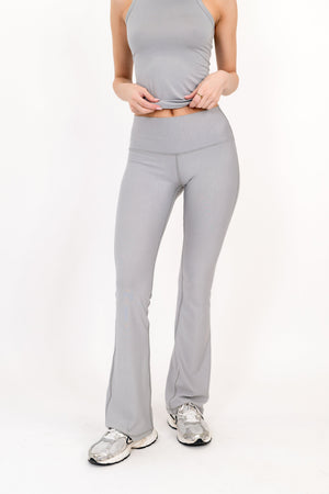 Gray flare legging front view, fitted waist with straight-to-bootcut leg opening.