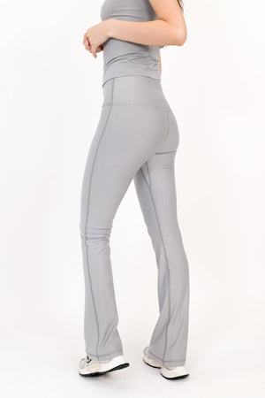 Gray flare legging side view, high-rise waist and bell-bottom style leg.