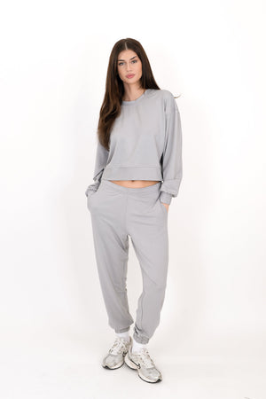 Gray sweatpants with elastic waistband and tapered ankle cuffs
