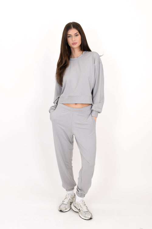 Gray sweatpants with elastic waistband and tapered ankle cuffs