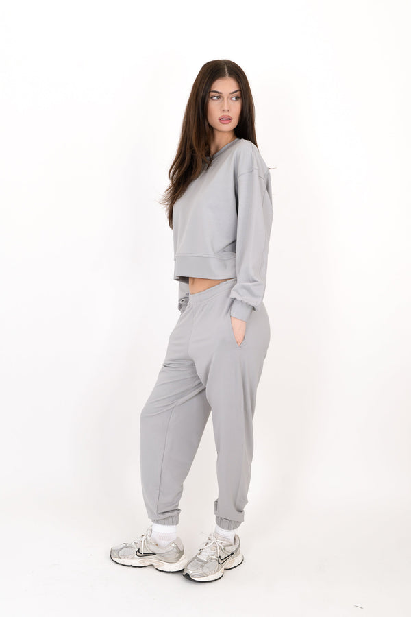 Gray sweatpants with elastic waistband and cuffed tapered ankles