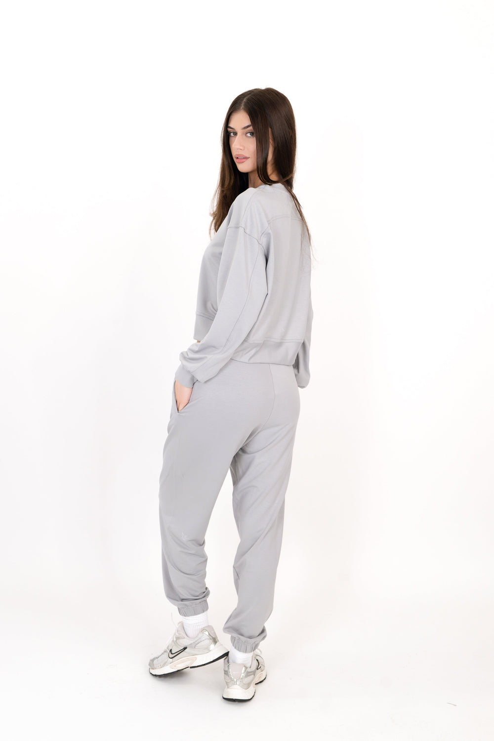 Gray sweatpants with elastic waistband and tapered ankle cuffs