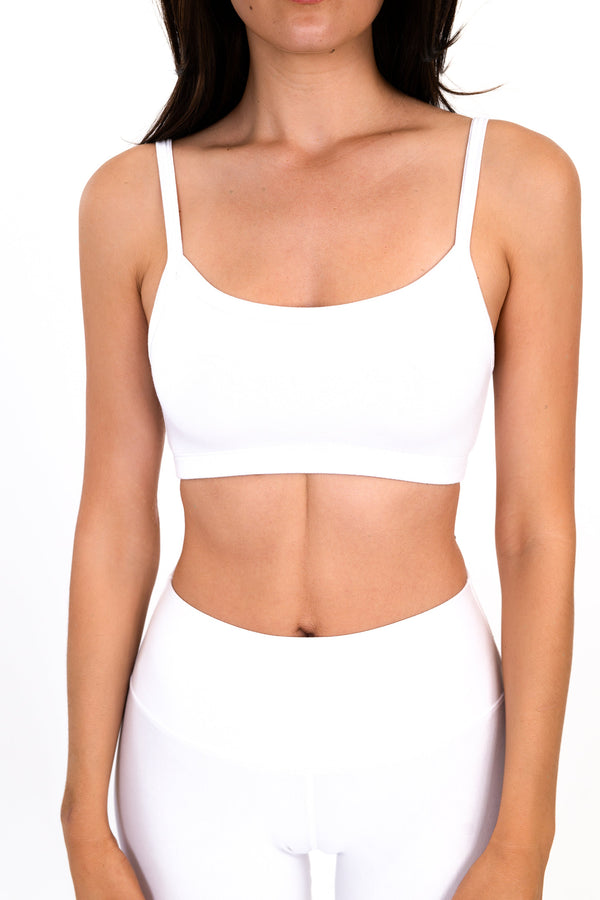 White scoop-neck bralette with thin adjustable straps, smooth seamless support