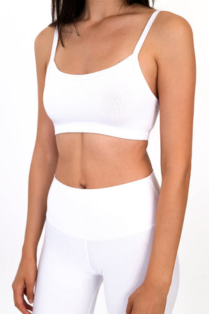 White scoop-neck bralette with thin straps and smooth underband support